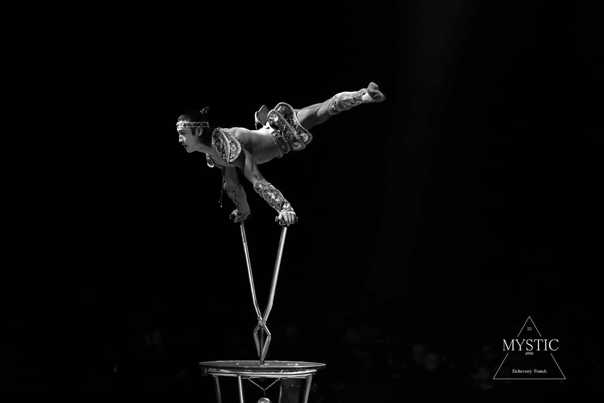 Ochir balancing in a black and white performance photograph