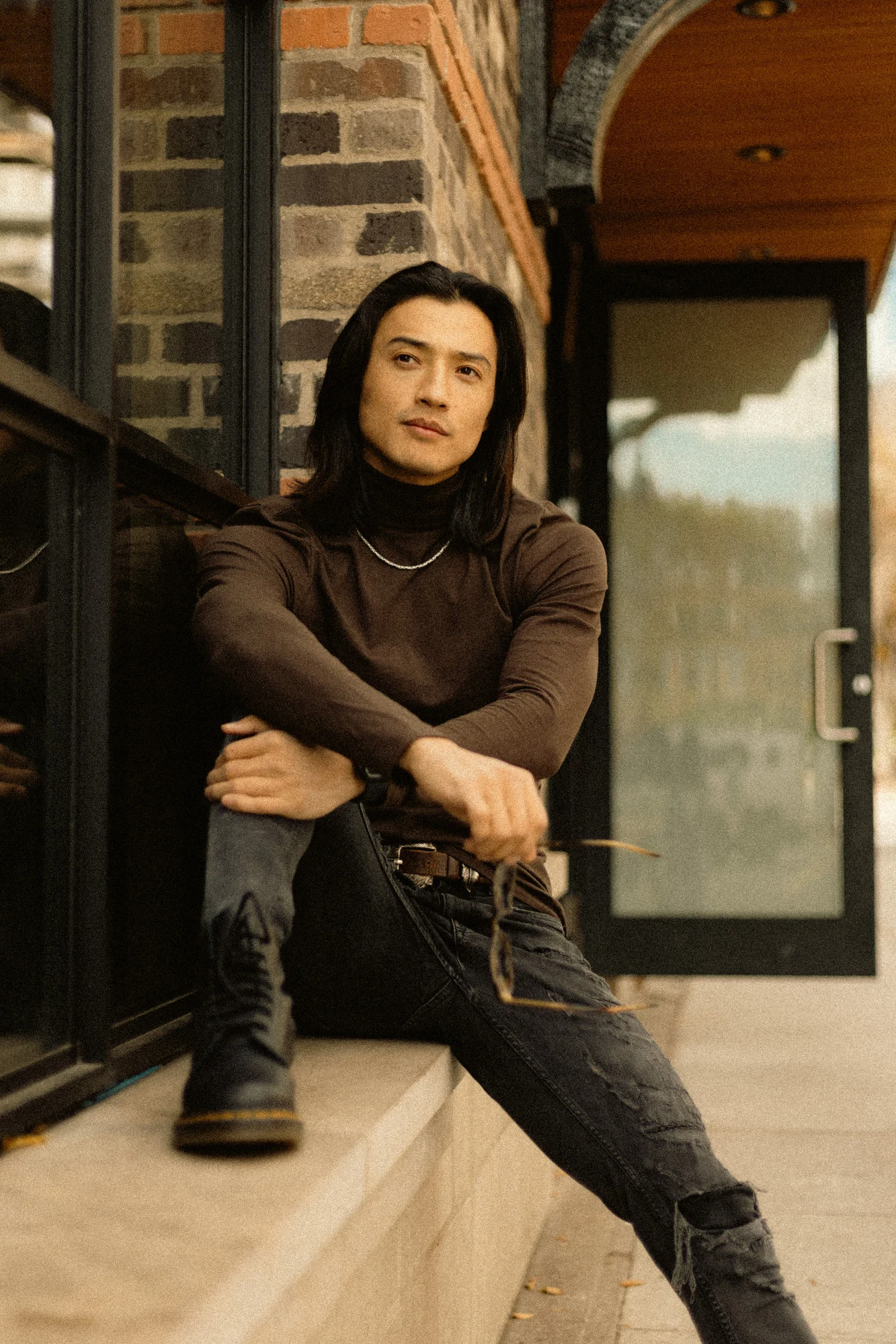 Portrait of Ochir seated by a window